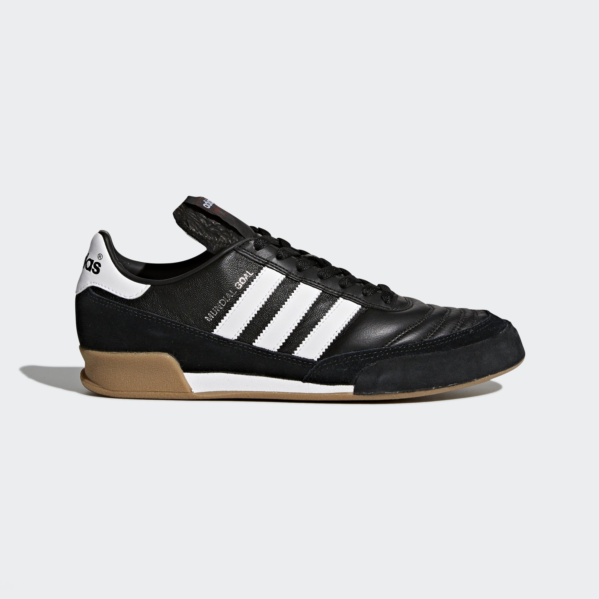 Adidas Mundial Goal indoor soccer shoe with black and white color scheme.
