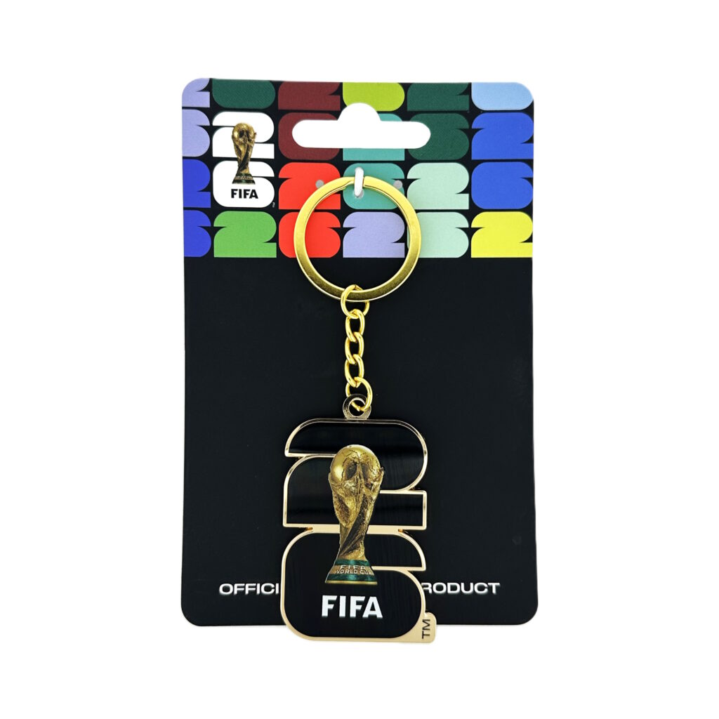 FIFA keychain on a branded card with colorful text in the background