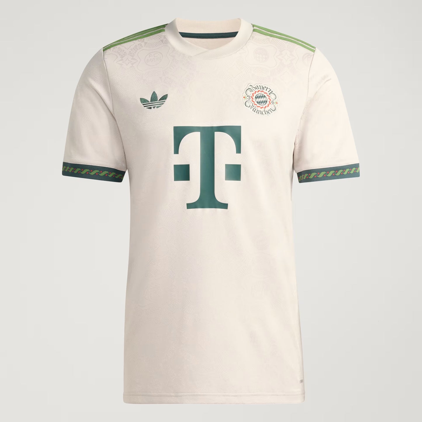 Beige sports jersey with green accents and logos on a light gray background