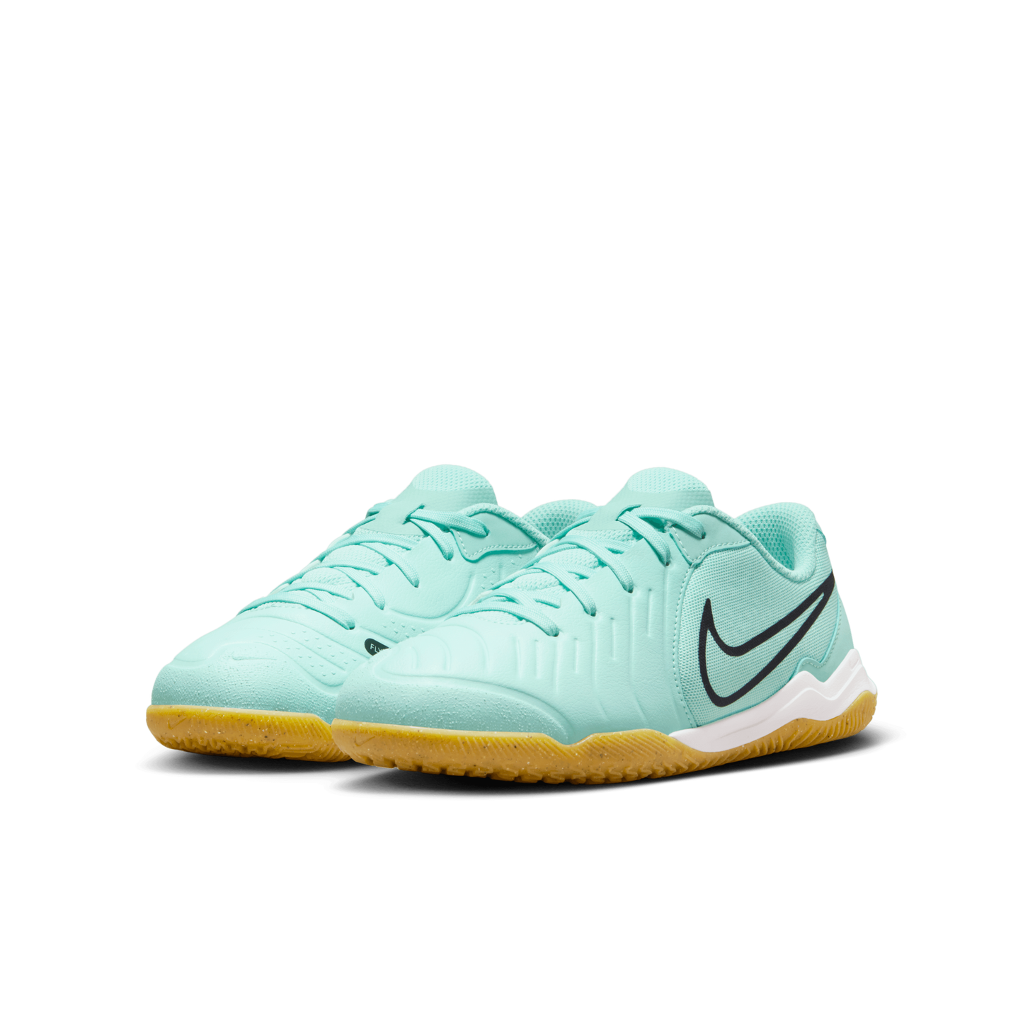 A pair of Nike Tiempo Legend 10 Academy indoor youth soccer shoes with a light blue upper and a yellow outsole.