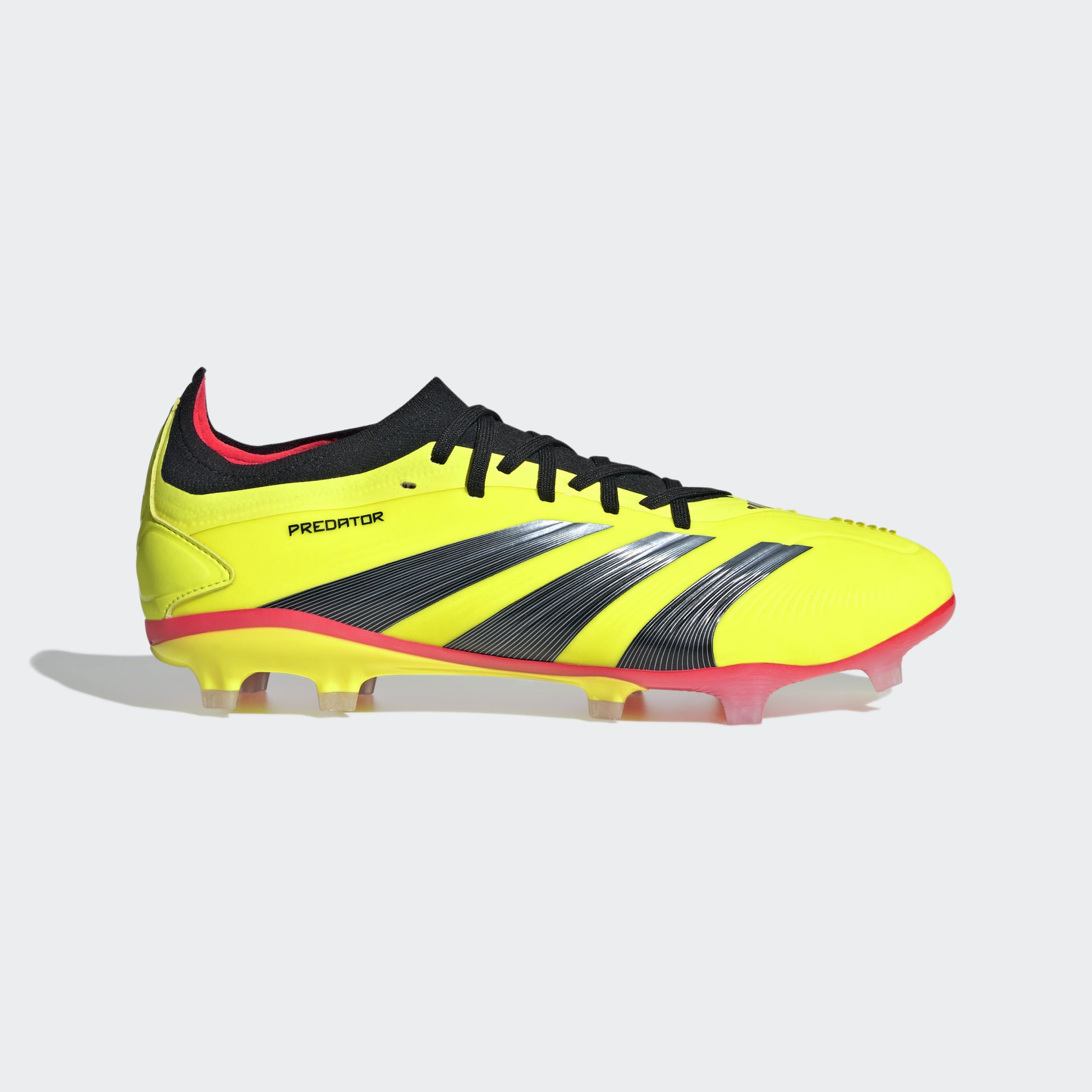 Yellow Adidas Predator 24 Pro FG soccer cleats with black and red accents.