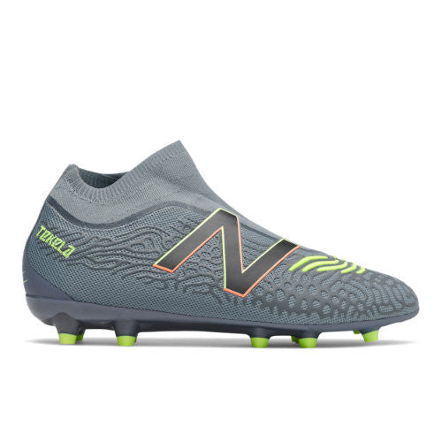 Gray soccer cleat with green accents on a white background