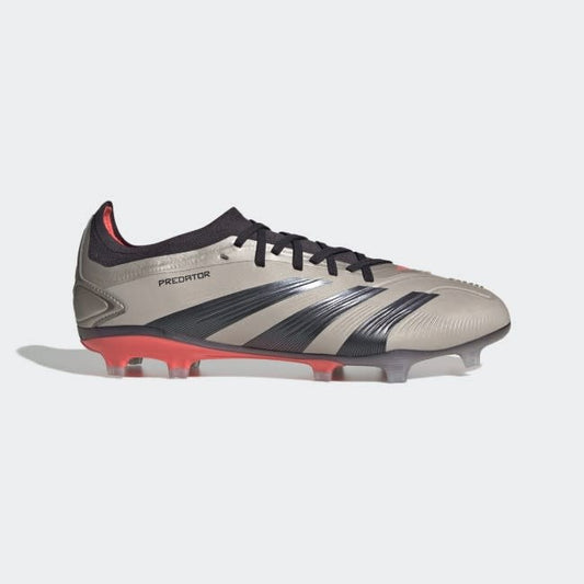 Adidas Predator Pro FG soccer cleats with a beige upper, black accents, and red sole.